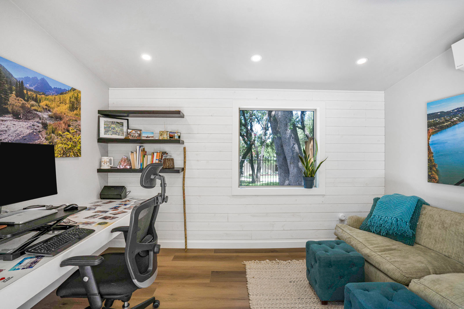 Finished backyard studio interior with built-in desk and lounge area